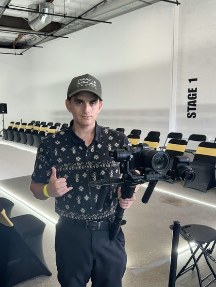 connor holding a large camera 