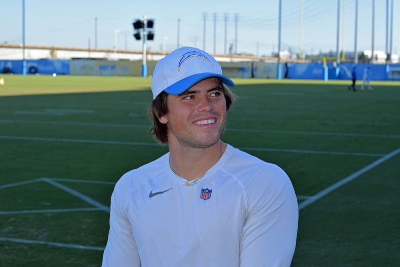 Cameron Dicker on a football field. 