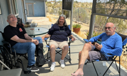 jj with his sister and brother sitting outside