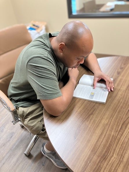 Jehada studying for his Driver's Permit test.