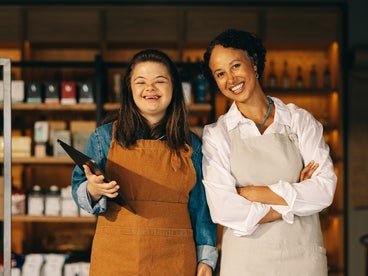 two young women working in a grocery store