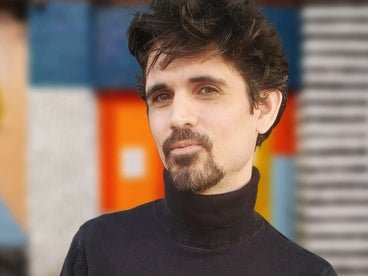 A headshot of AAB member Arman Khodaei. 