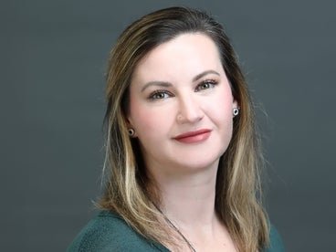 A headshot of Director of Research Operations, Meghan Herron.