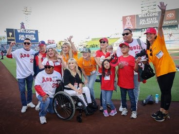 A photo of participants and staff on the field during Angels Night. 