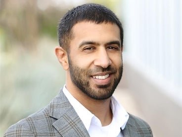 A professional headshot of Dr. Shaji Haq.