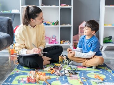 woman and child playing and learning together