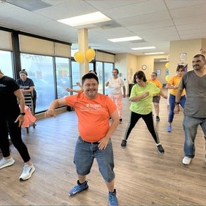 group of people doing zumba