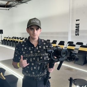 connor holding a large camera 
