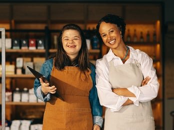 two young women working in a grocery store
