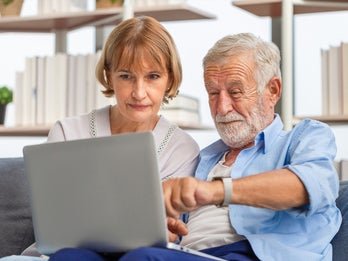 Older couple looking at computer