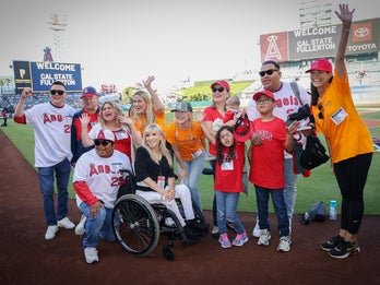 A photo of participants and staff on the field during Angels Night. 