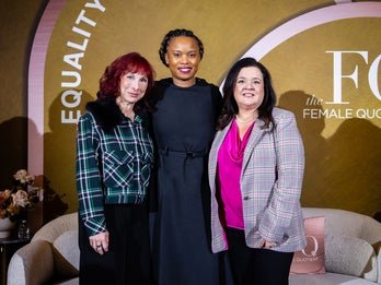 Three women on stage.
