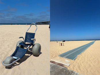 On the left is a blue beach wheelchair and on the right is a beach mat leading out to the water