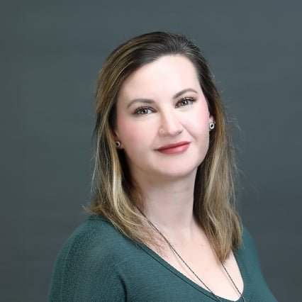 A headshot of Director of Research Operations, Meghan Herron.