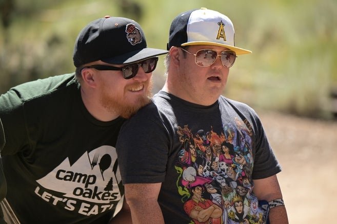 two men standing next to each other