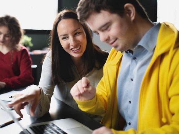 person in yellow sweater