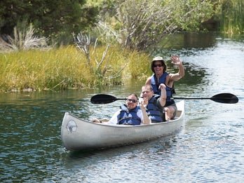 three men in canoe