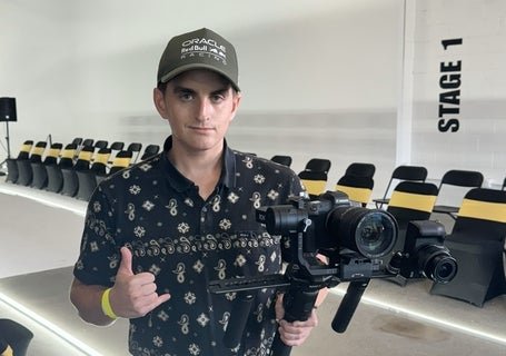 connor holding a large camera 